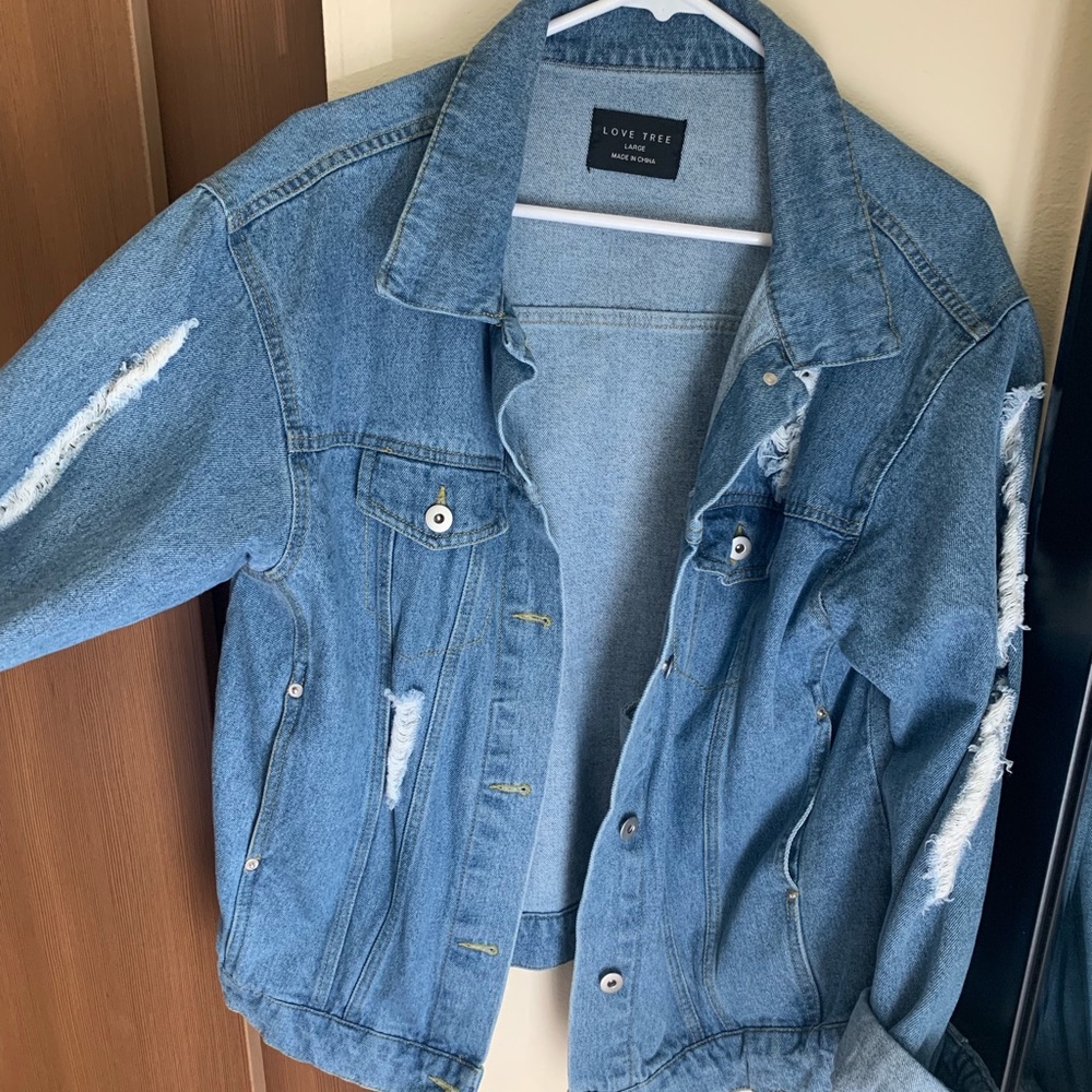 Blue torn denim jacket
